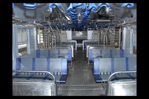 3+3 seating is provided in second class, along with handholds for standing passengers.